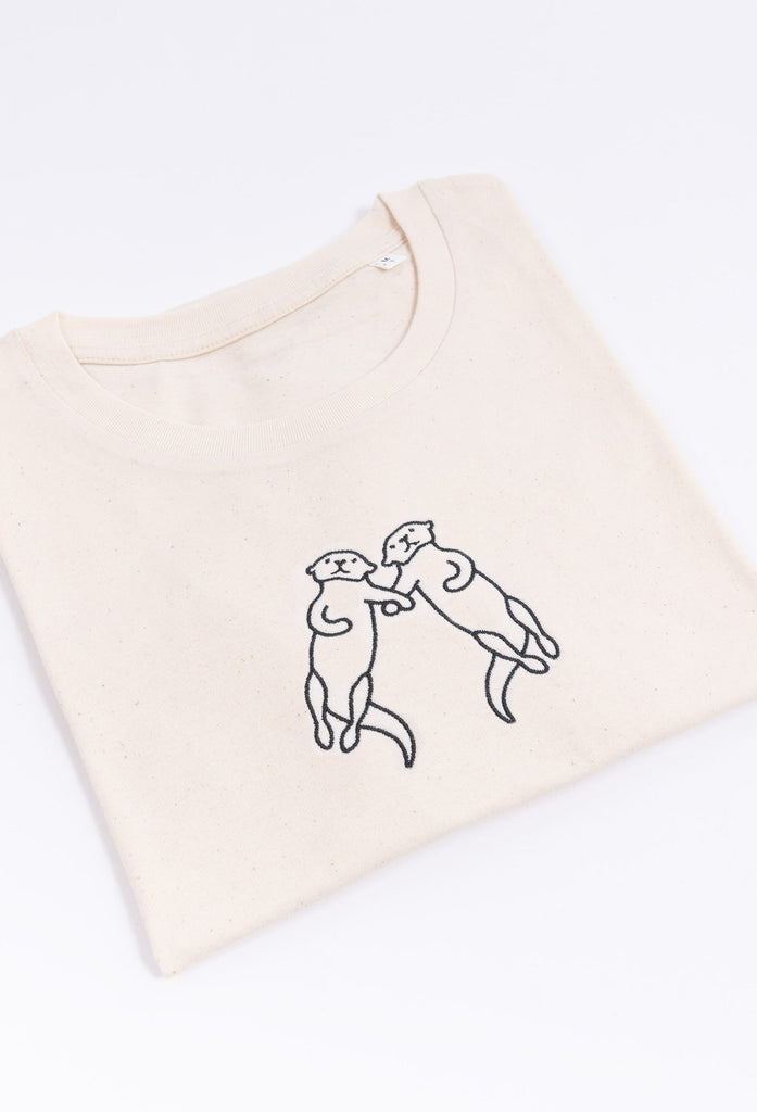 family of otters unisex cropped t-shirt Big Wild Thought