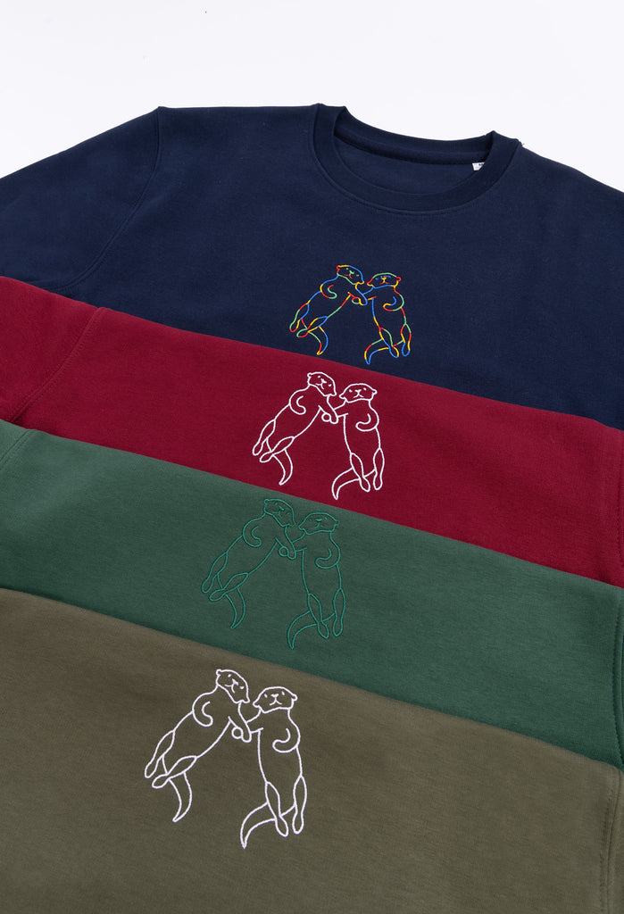 family of otters unisex cropped t-shirt Big Wild Thought